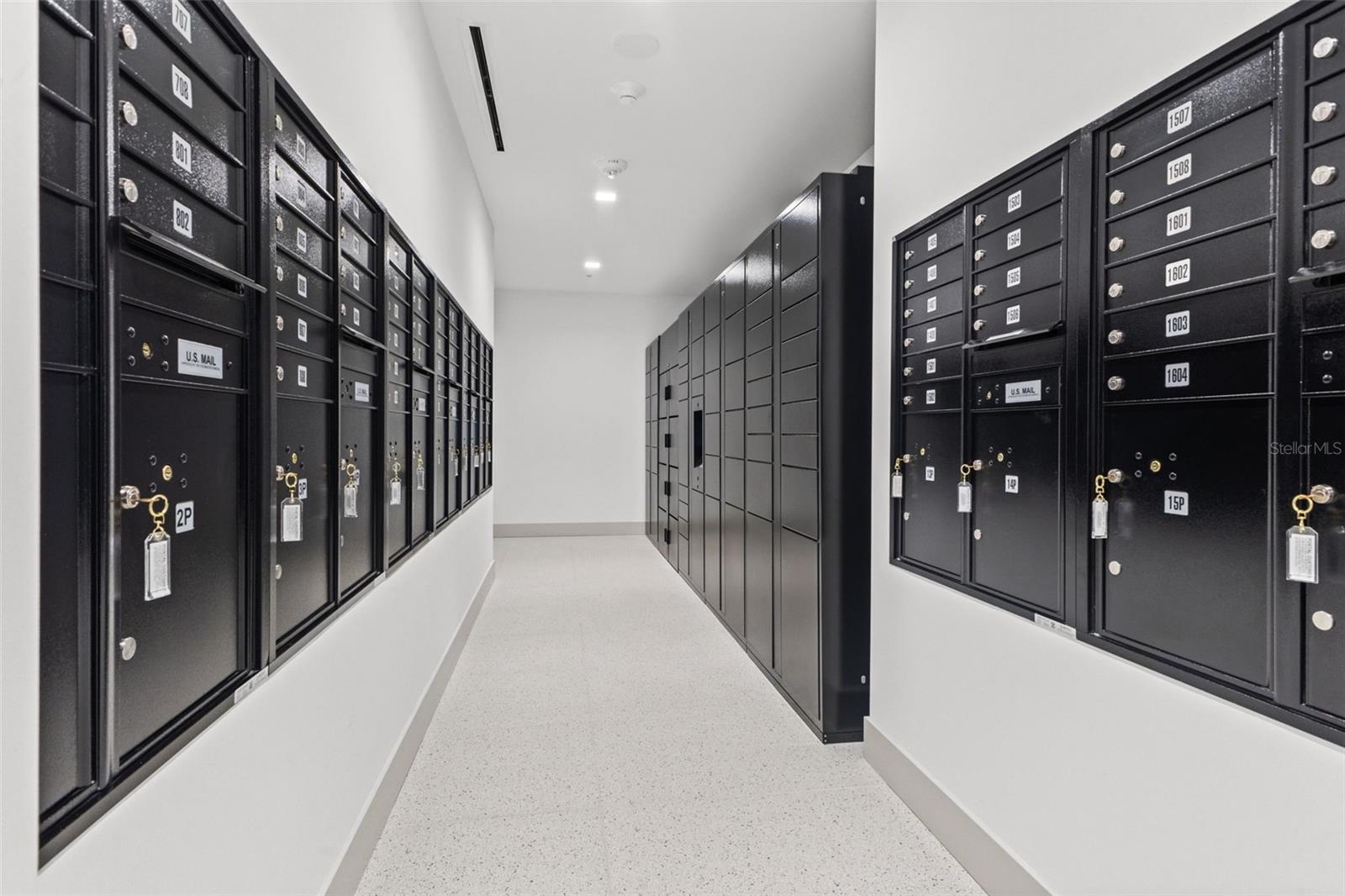 Mail room with package lockers and refrigerators