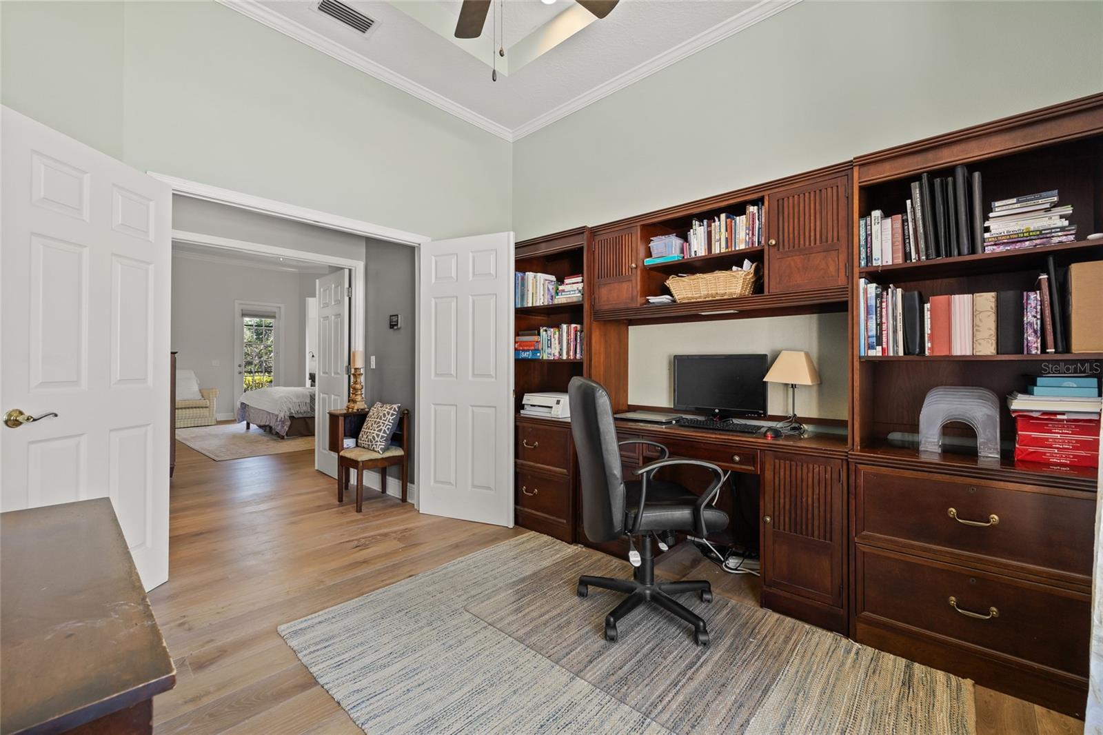 Beautiful office built-ins anchor the office space.