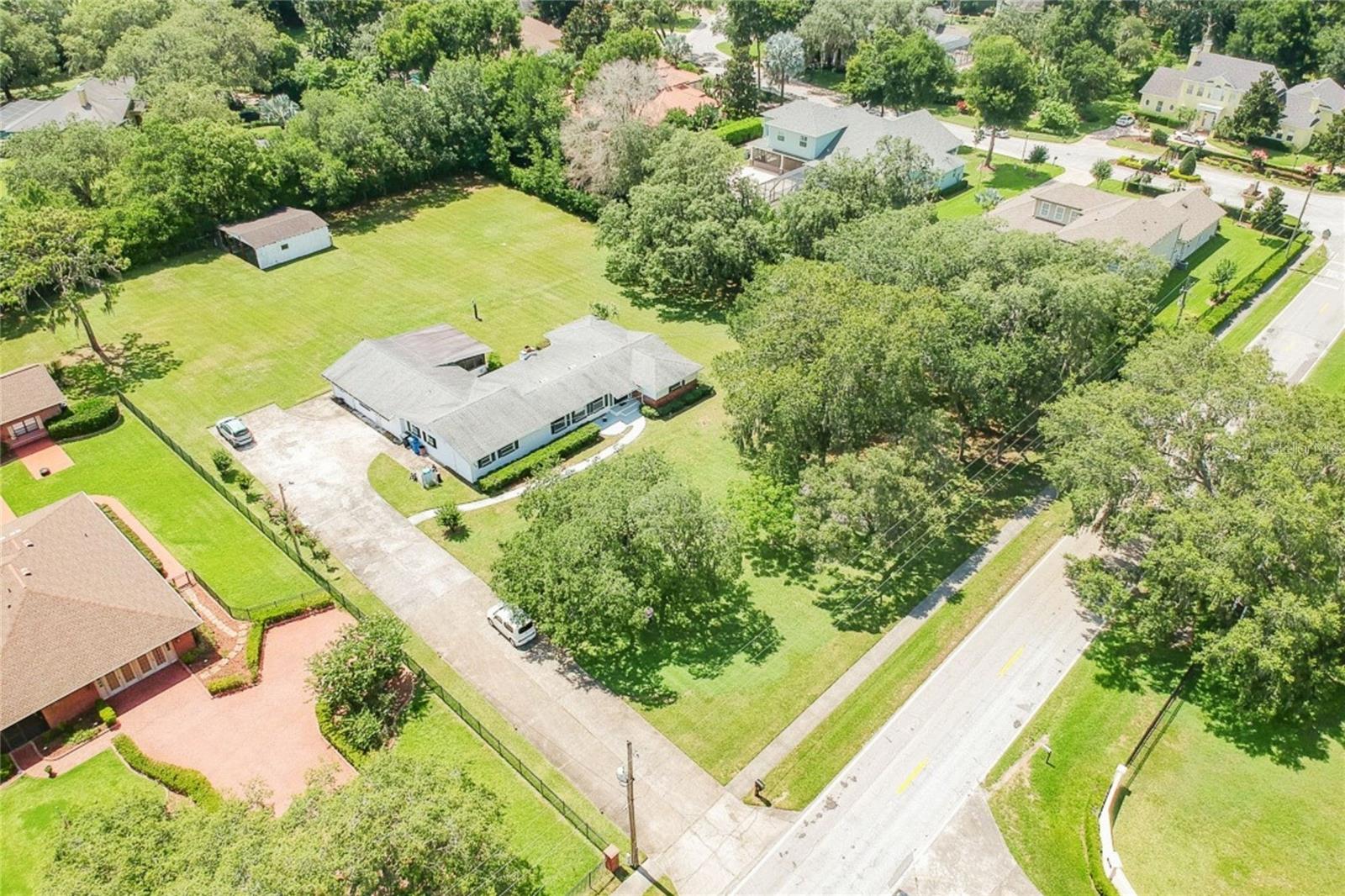 Aerial Angle Showing Home, Barn, Large Lot and Mature Trees