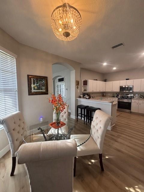 Dining room with kitchen view.