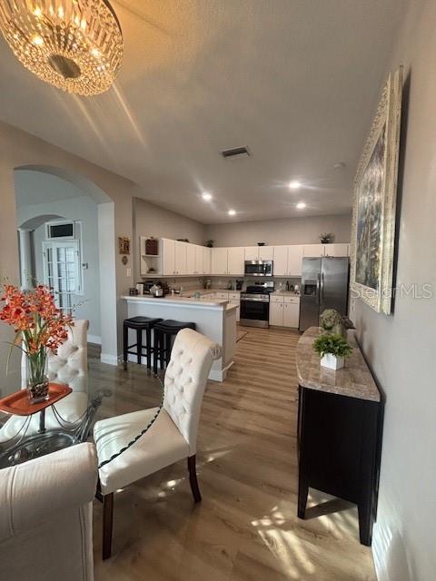 Dining room with view of the kitchen.