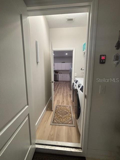 Laundry room and view of the kitchen.