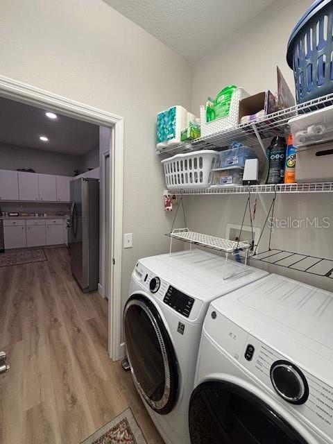 Inside laundry with view of kitchen.