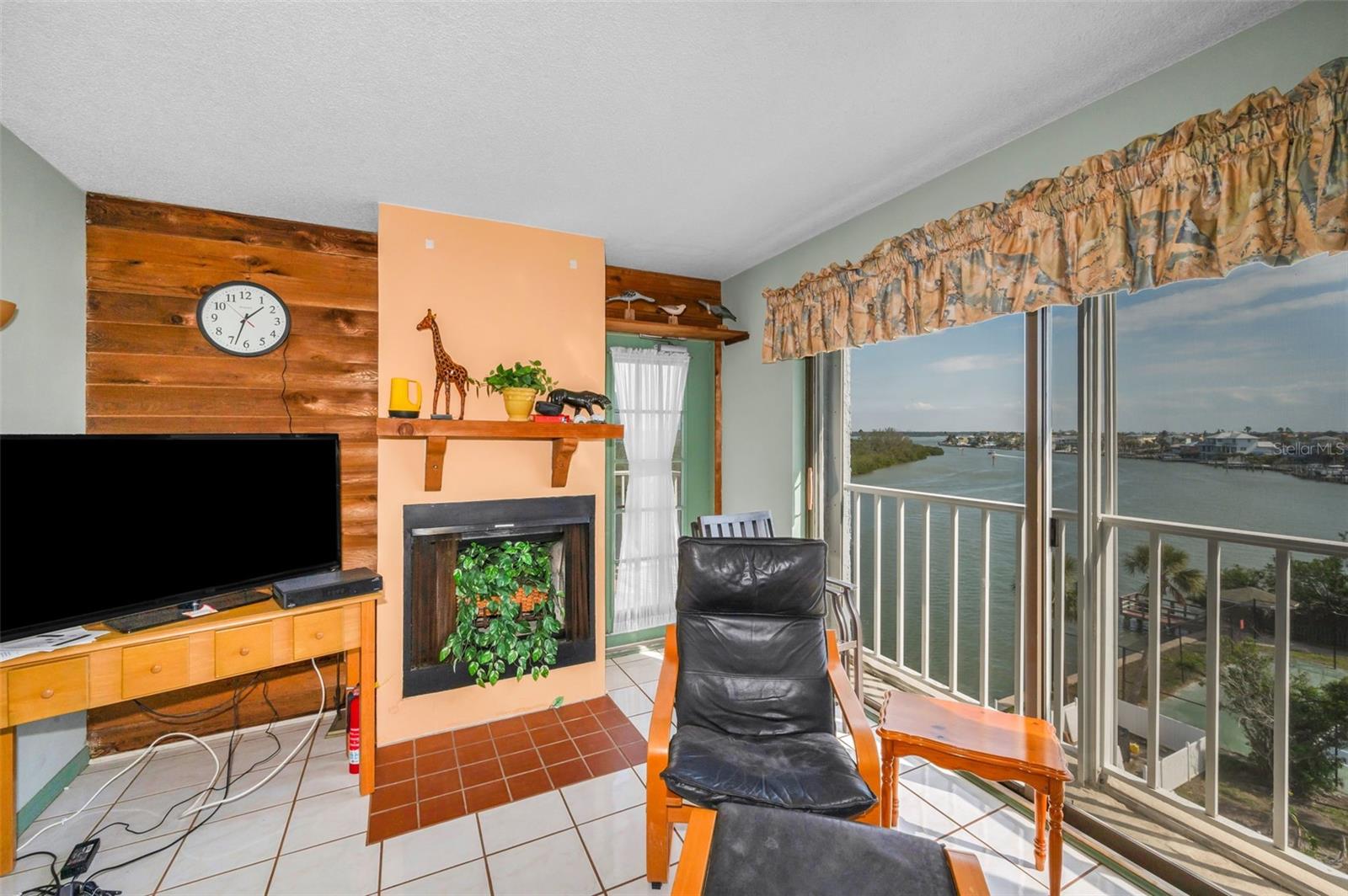 Living Room with Fireplace and sliding glass doors with view of the Intracoastal!