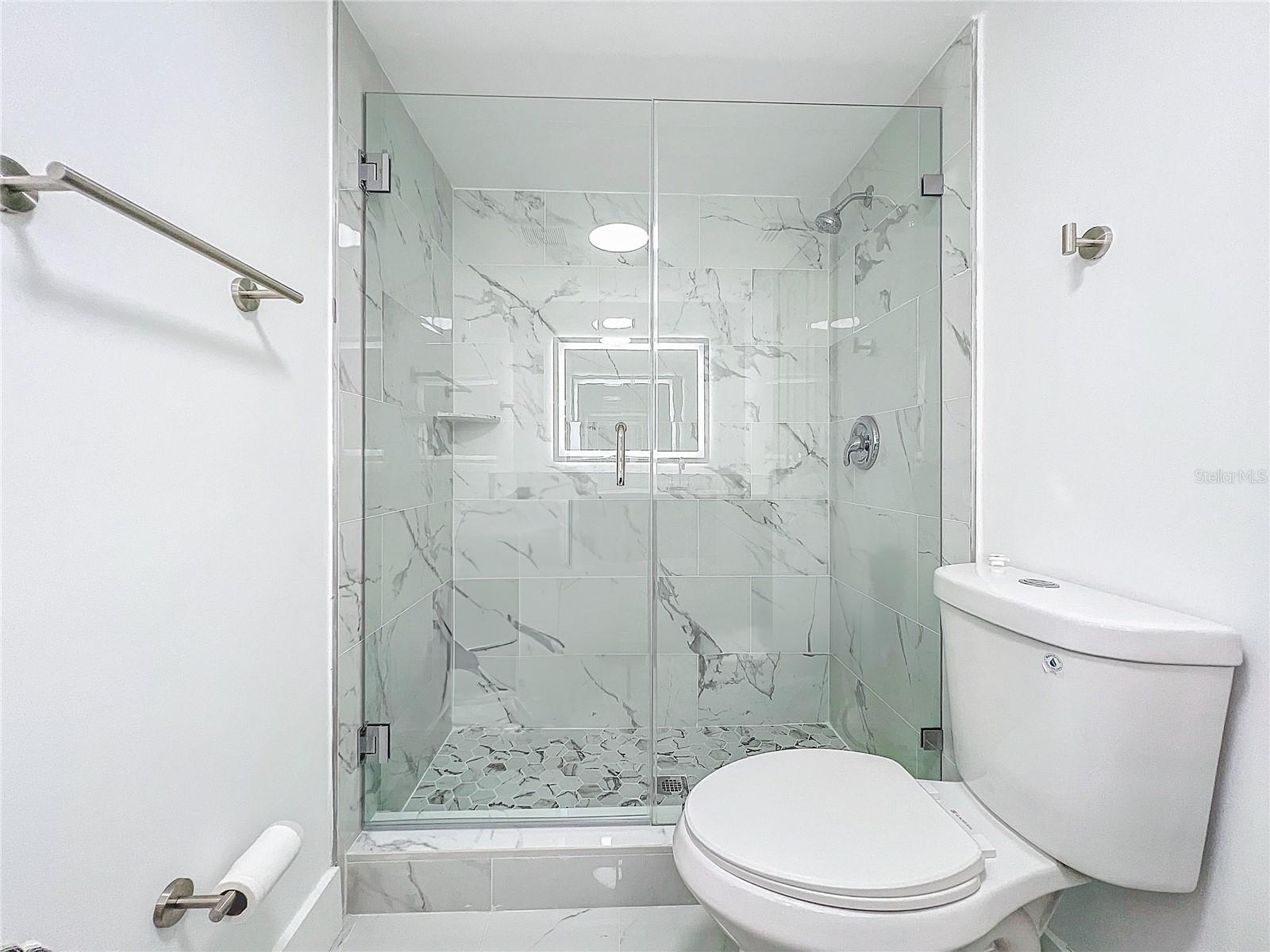 Primary Bathroom, stand up shower, white tile throughout