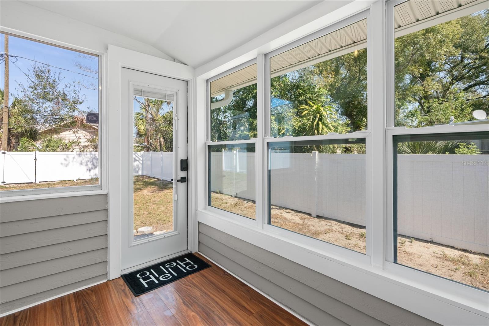 Small enclosed porch off kitchen and home rear entry.