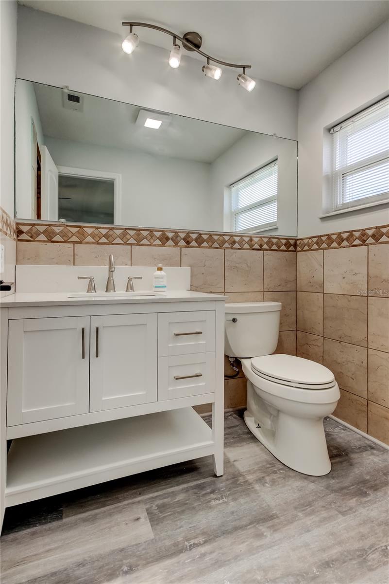 Owners Retreat Bathroom (4.10' x 9') Offers Walk in Shower, New Vanity, & Spaciousness..