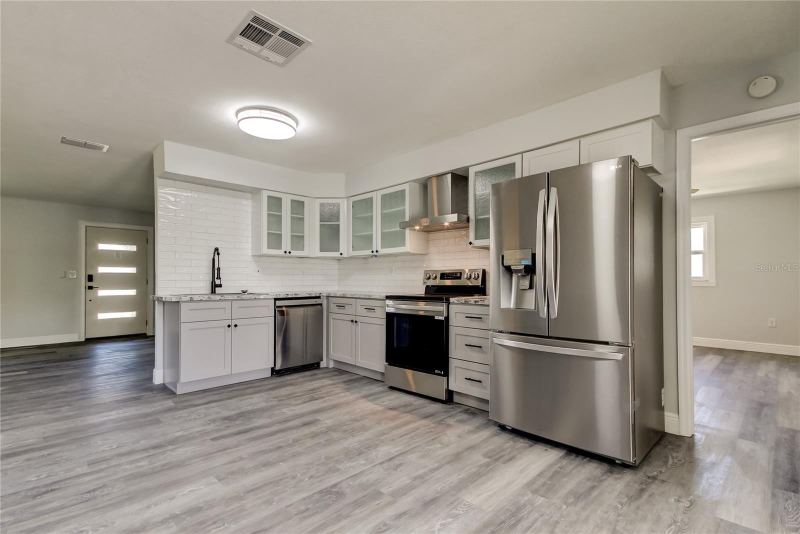 OPEN CONCEPT Kitchen (9' x 16.9') w 2-Tone Custom Cabinetry, Stainless Appliances, Farmhouse Sink, Custom Epoxy Countertops, Aplenty Cabinets & Counterspace