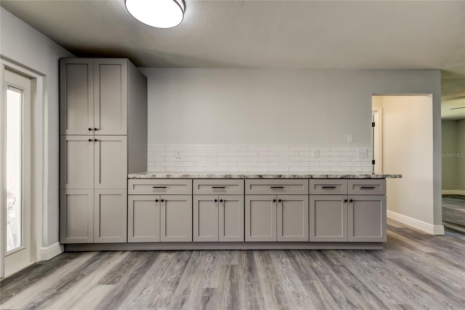 OPEN CONCEPT Kitchen (9' x 16.9') w 2-Tone Custom Cabinetry Covers the Wall Ending w A Ceiling Height Pantry!!  Created Loads of Extra Countertops!!