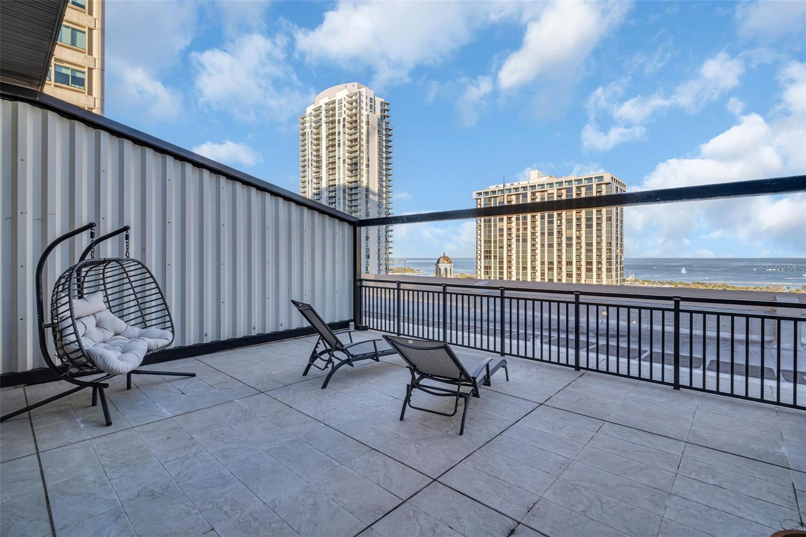 Expansive rooftop patio attached to 2nd Bedroom