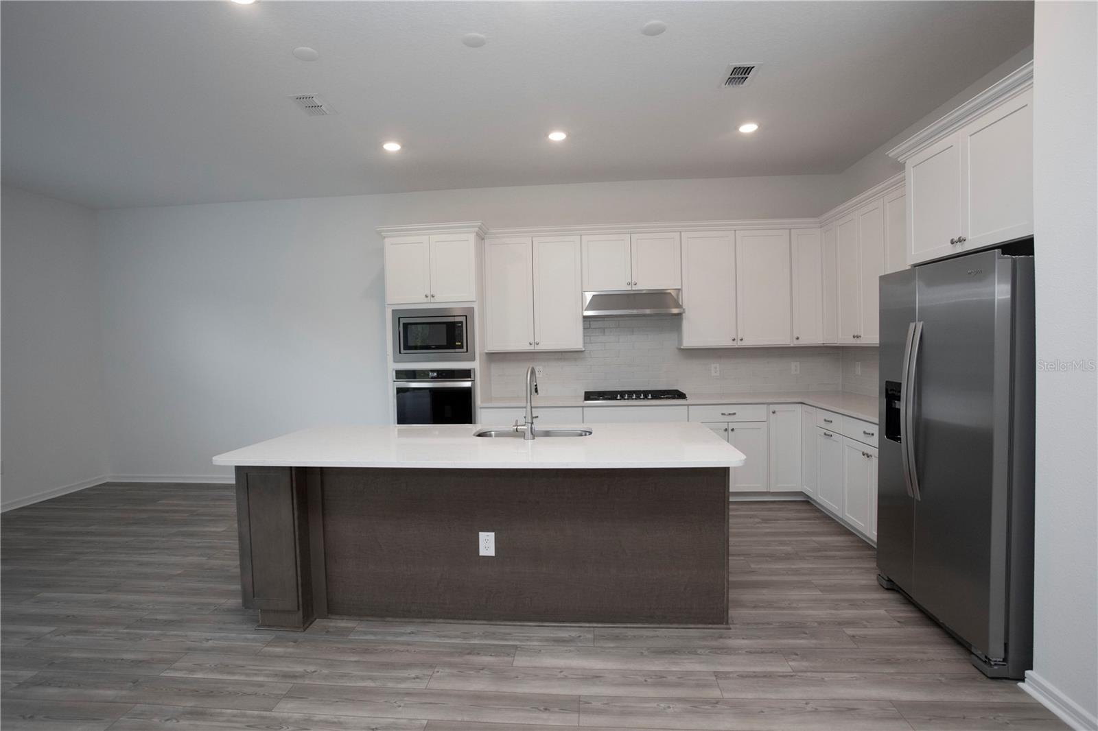 BEAUTIFULLY APPOINTED KITCHEN WITH STORAGE AND COUNTER SPACE!