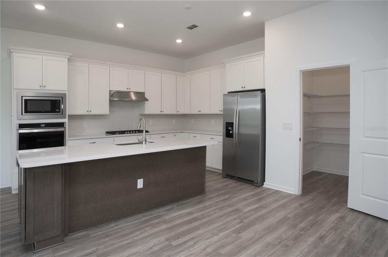 BEAUTIFULLY APPOINTED KITCHEN WITH STORAGE AND COUNTER SPACE!