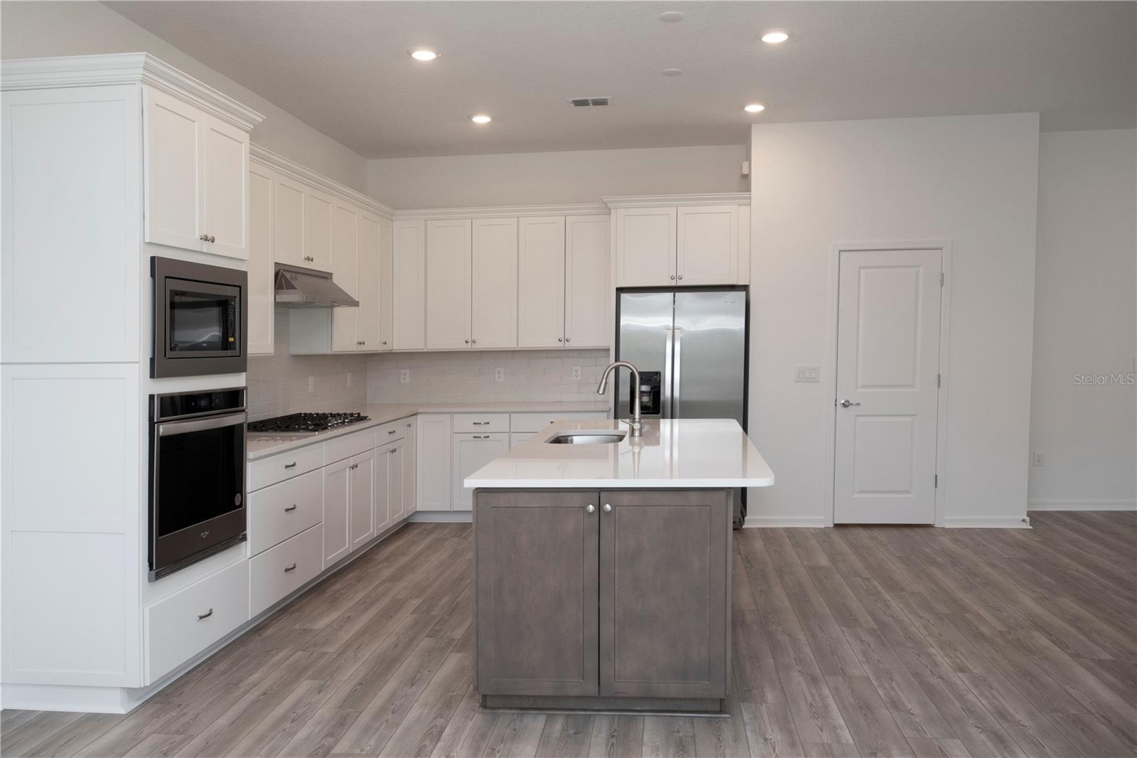 BEAUTIFULLY APPOINTED KITCHEN WITH STORAGE AND COUNTER SPACE!