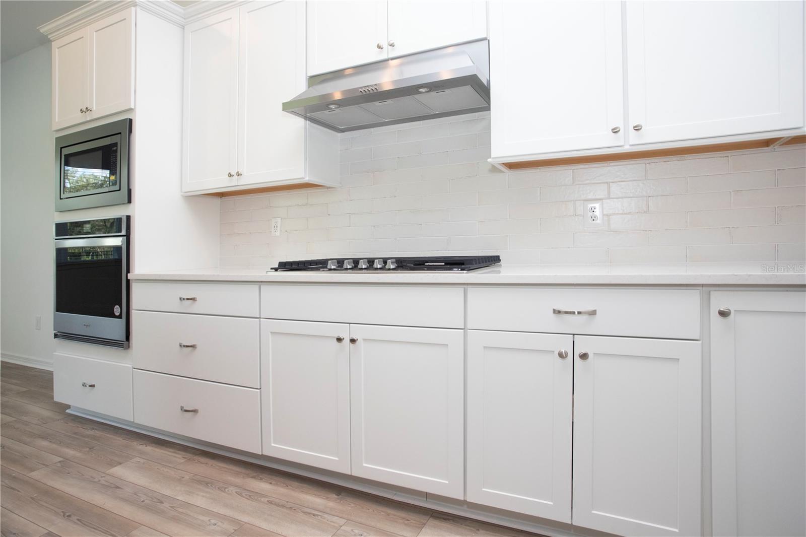 BEAUTIFULLY APPOINTED KITCHEN WITH STORAGE AND COUNTER SPACE!