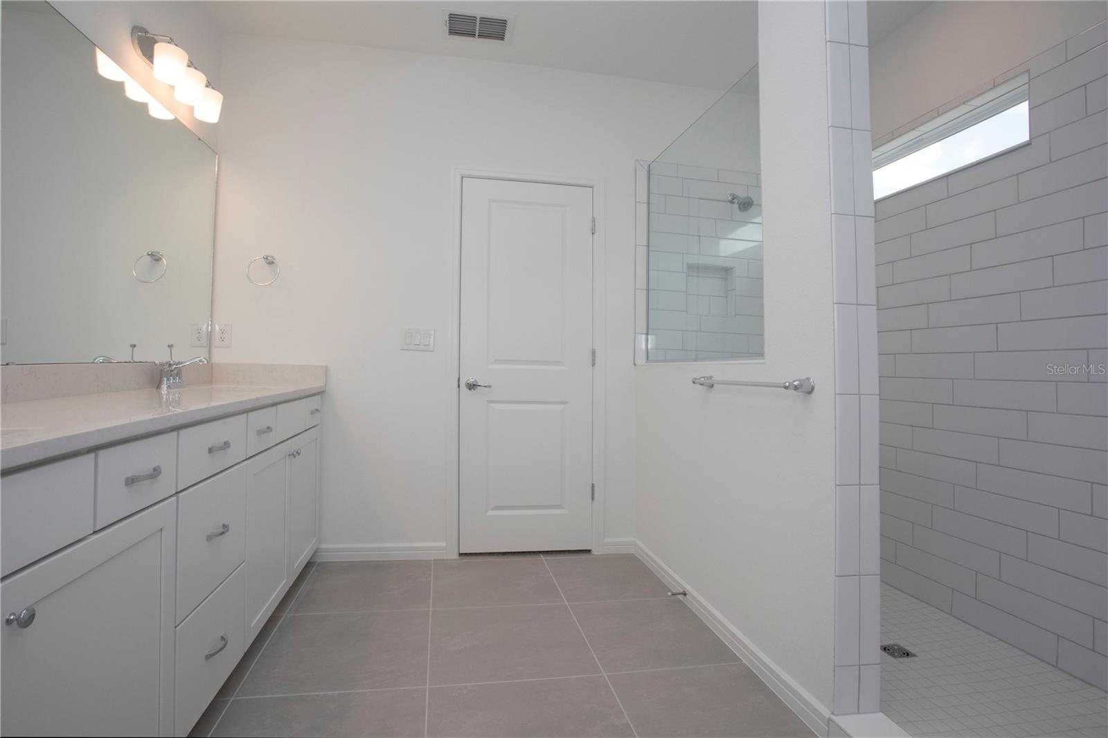 MASTER BATH WITH HUGE WALK-IN SHOWER. DOUBLE SINK VANITY/