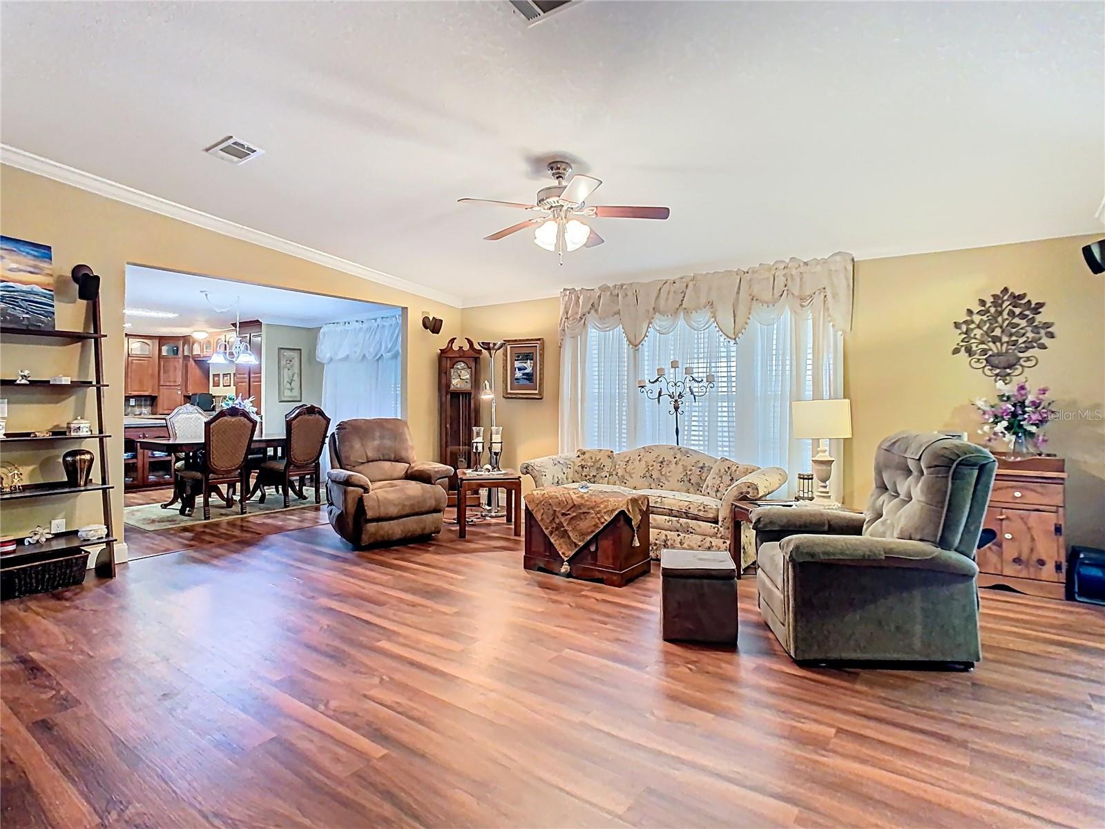 Large living room with crown molding