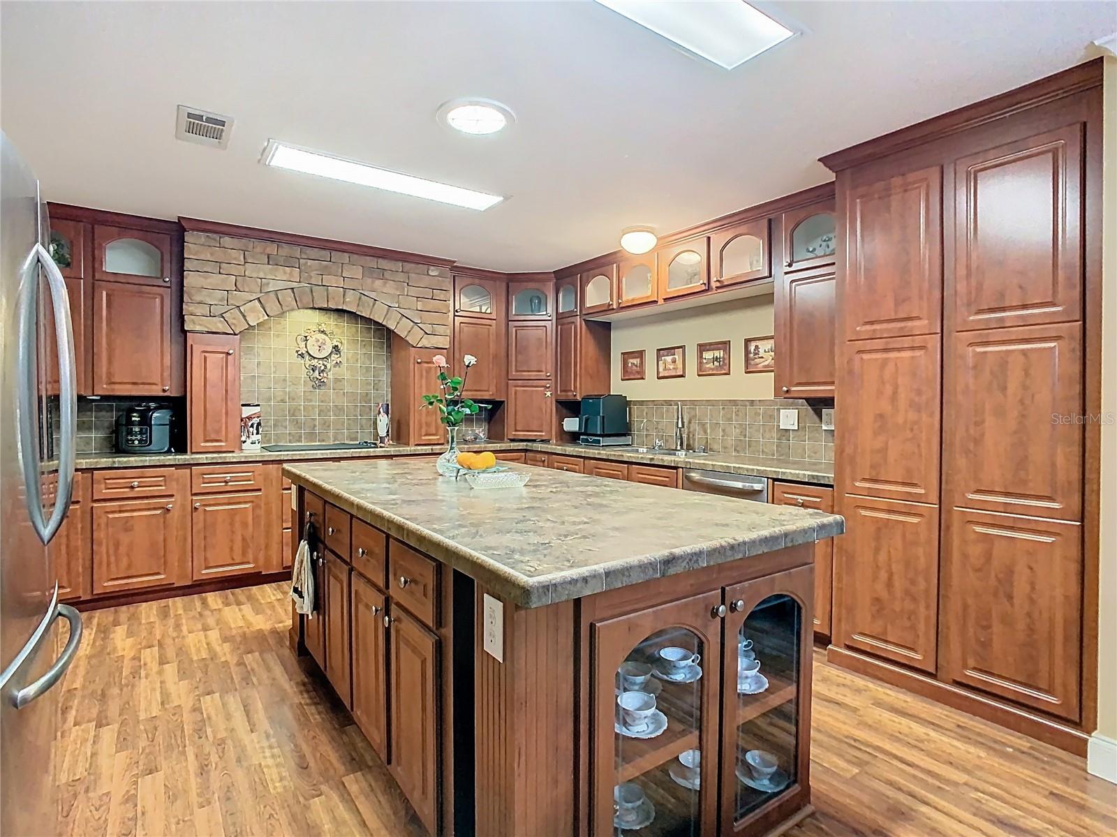 Spacious kitchen with built-in oven and microwave and storage galore