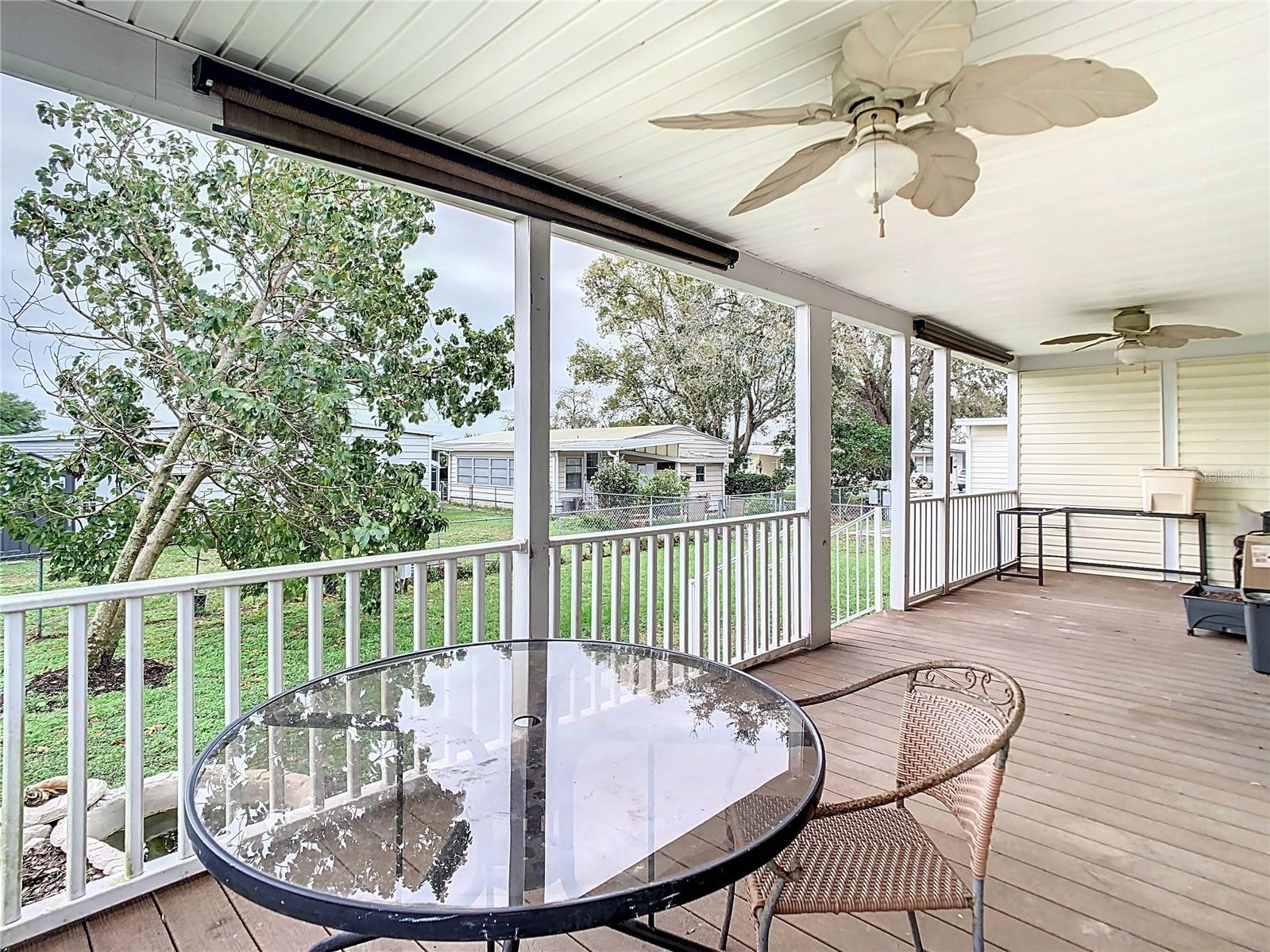 Porch at back of home overlooks yard