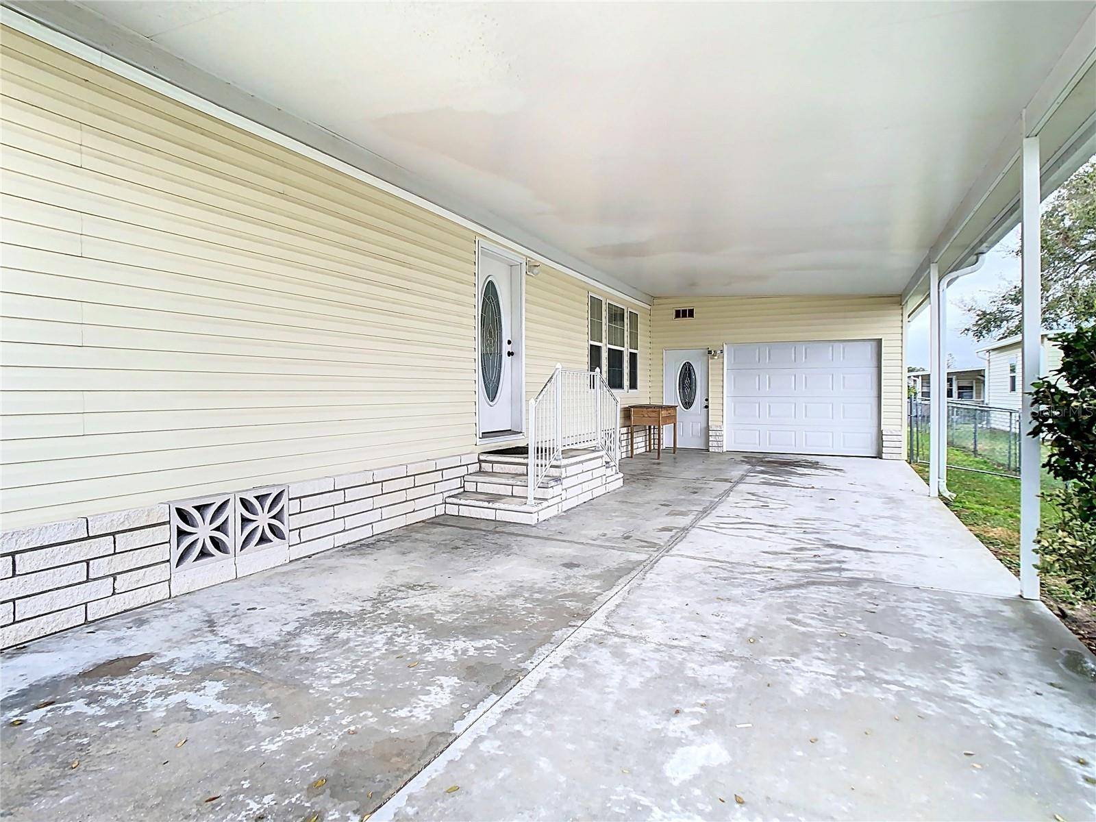 Plenty of parking space leading to a deep tandem garage.