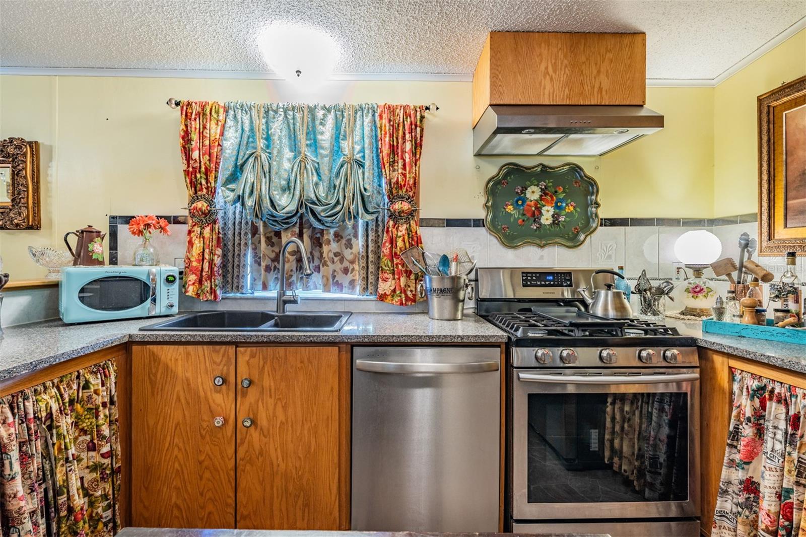 Window above Granite sink with upgraded gas range and stainless appliances!