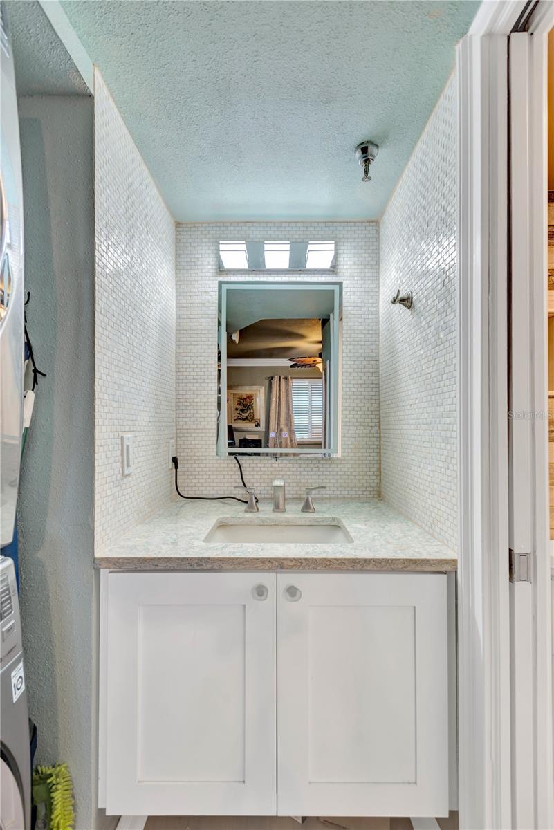 Vanity with under cabinet storage, attractively appointed.