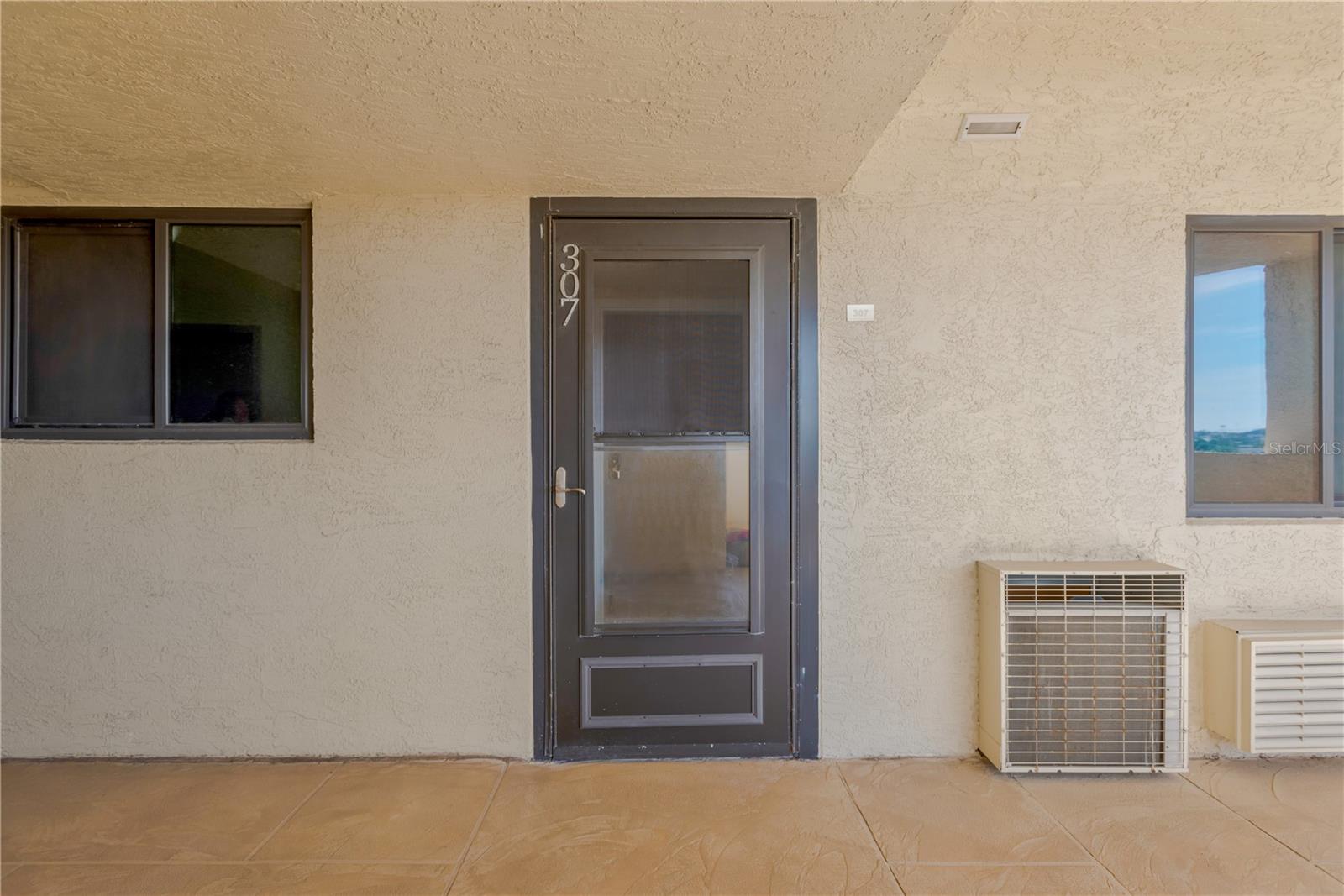 Private entrance with storm door protects your foyer entrance into unit.