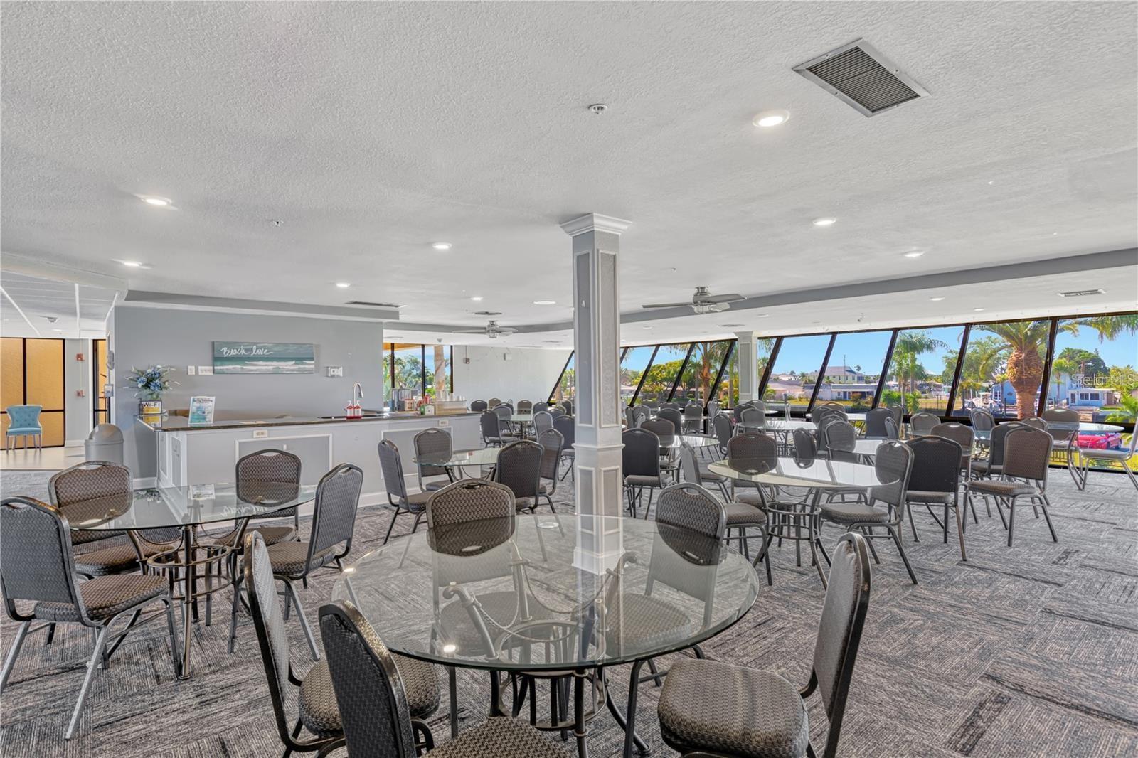 Beautiful clubhouse with floor to ceiling glass windows is home to many social events and parties.  As an owner you can also rent it out for a private event by seeing the Association Manager.