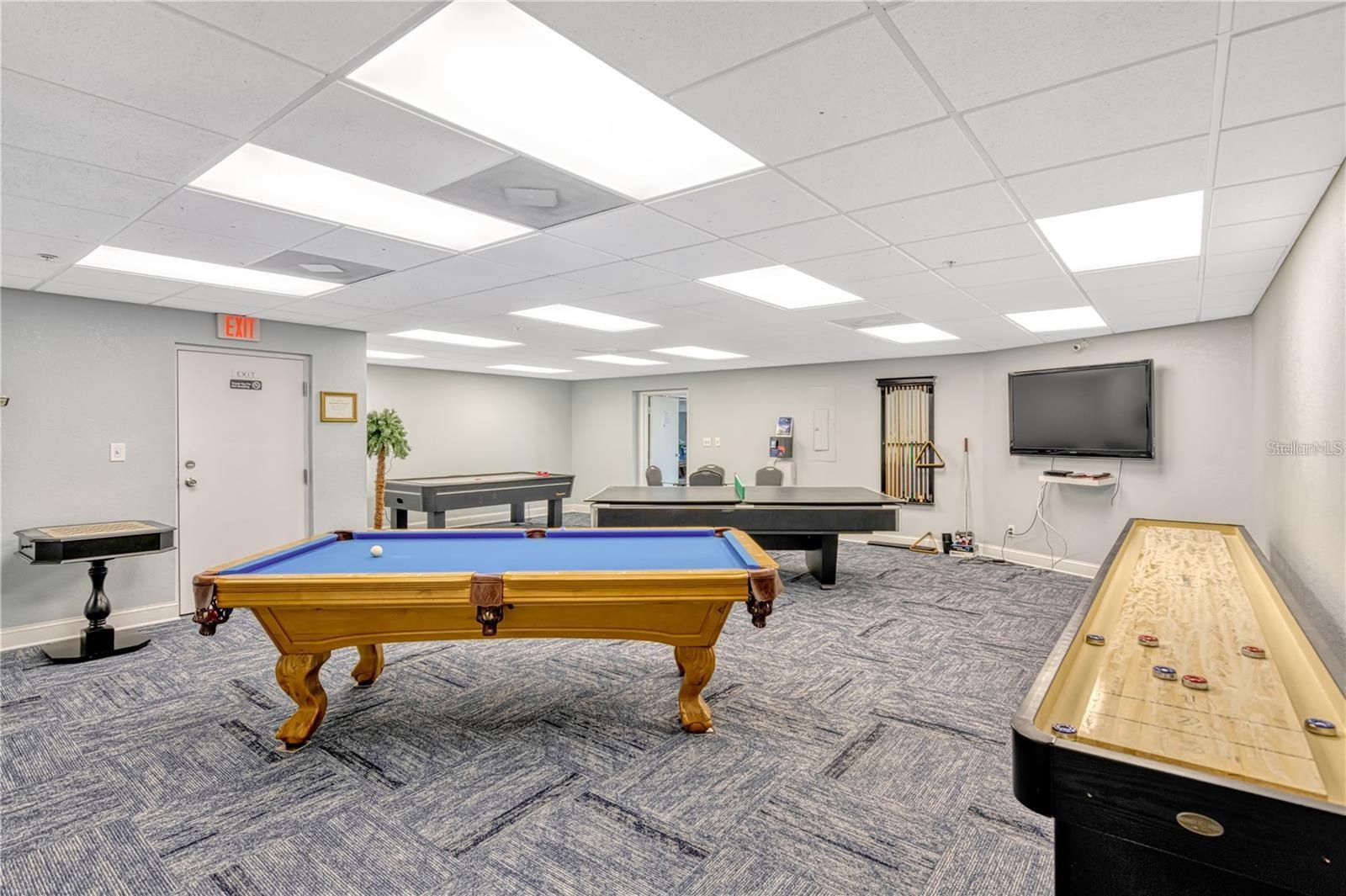 If enjoying a competitive game of pool, you will take delight in this recreation room.