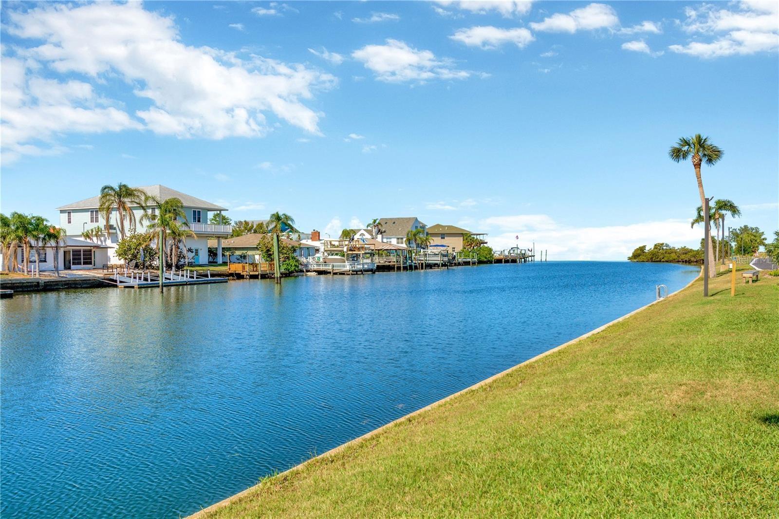 Canal view and green space that is also a favorite to pet owners as a dog walk.