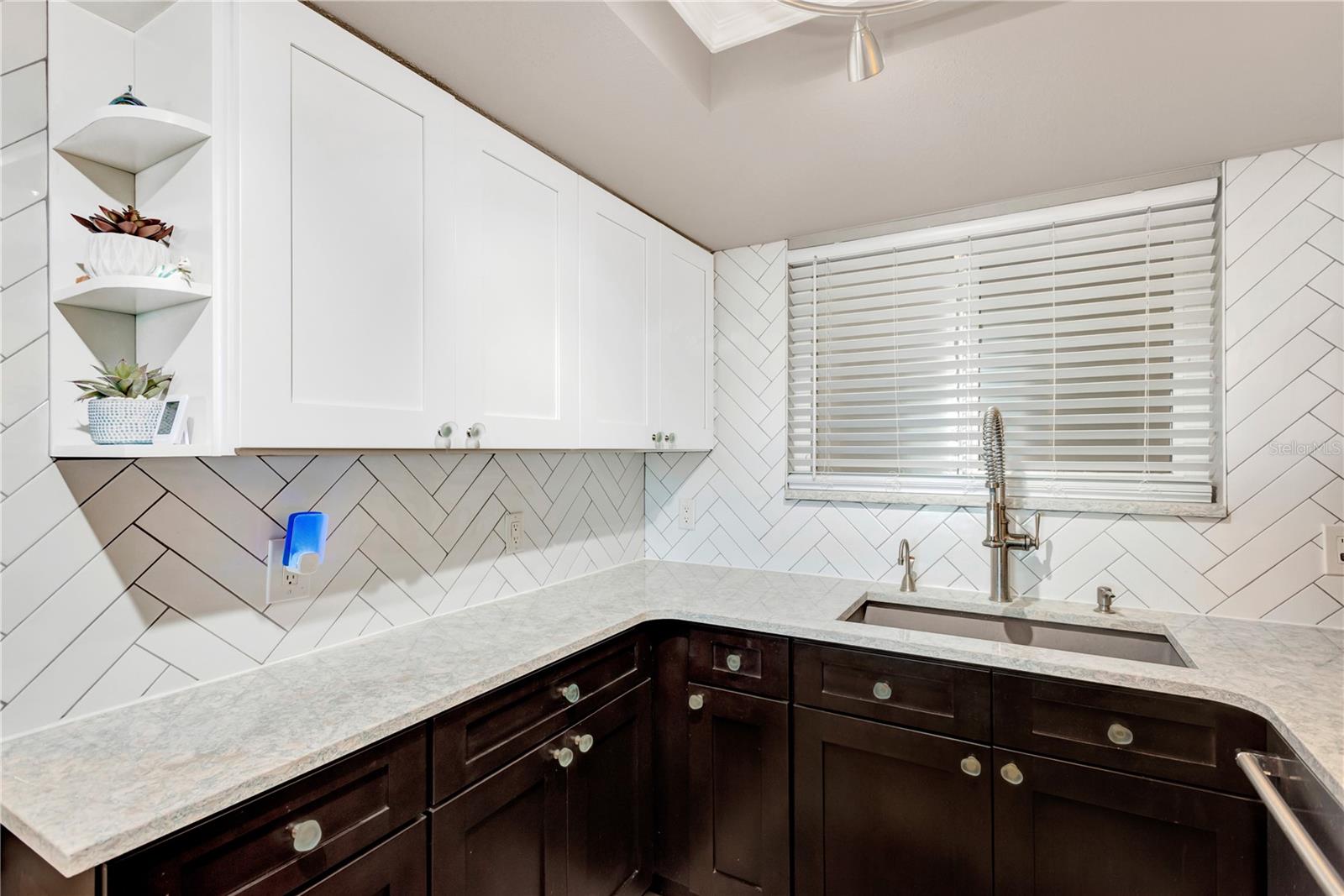 Abundance of counter space is always welcome.  Lovely coordinating backsplash is new addition to this amazing kitchen.