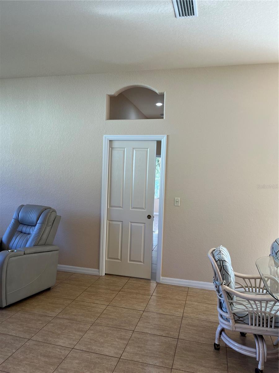 Pocket door to 3rd wing leading to bedrooms 3 & 4