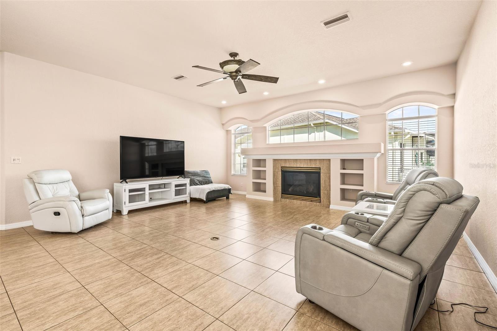 family room with floor outlet to rearrange furniture