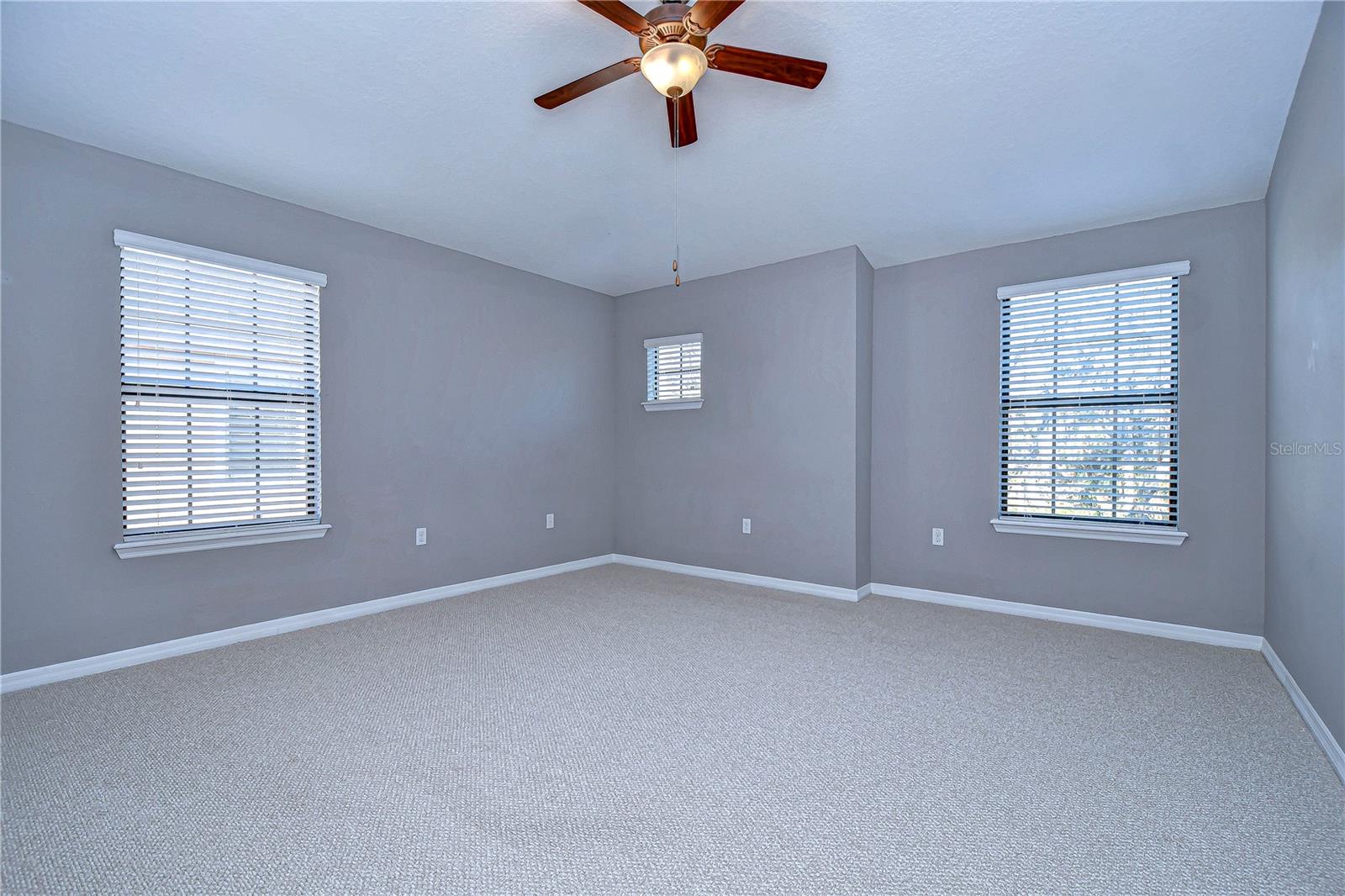 This spacious primary bedroom offers a tranquil retreat with ample room to reimagine your sanctuary.