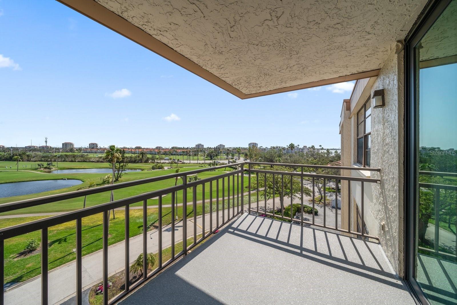 Covered balcony off living room and primary bedroom