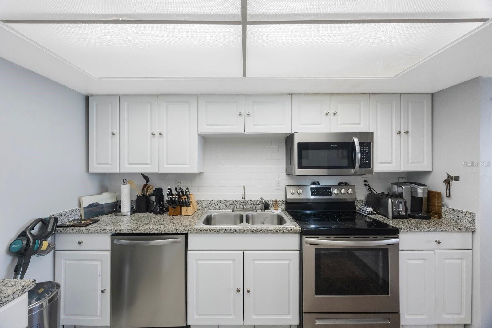 Kitchen with Stainless Steel and Granite Counter Tops