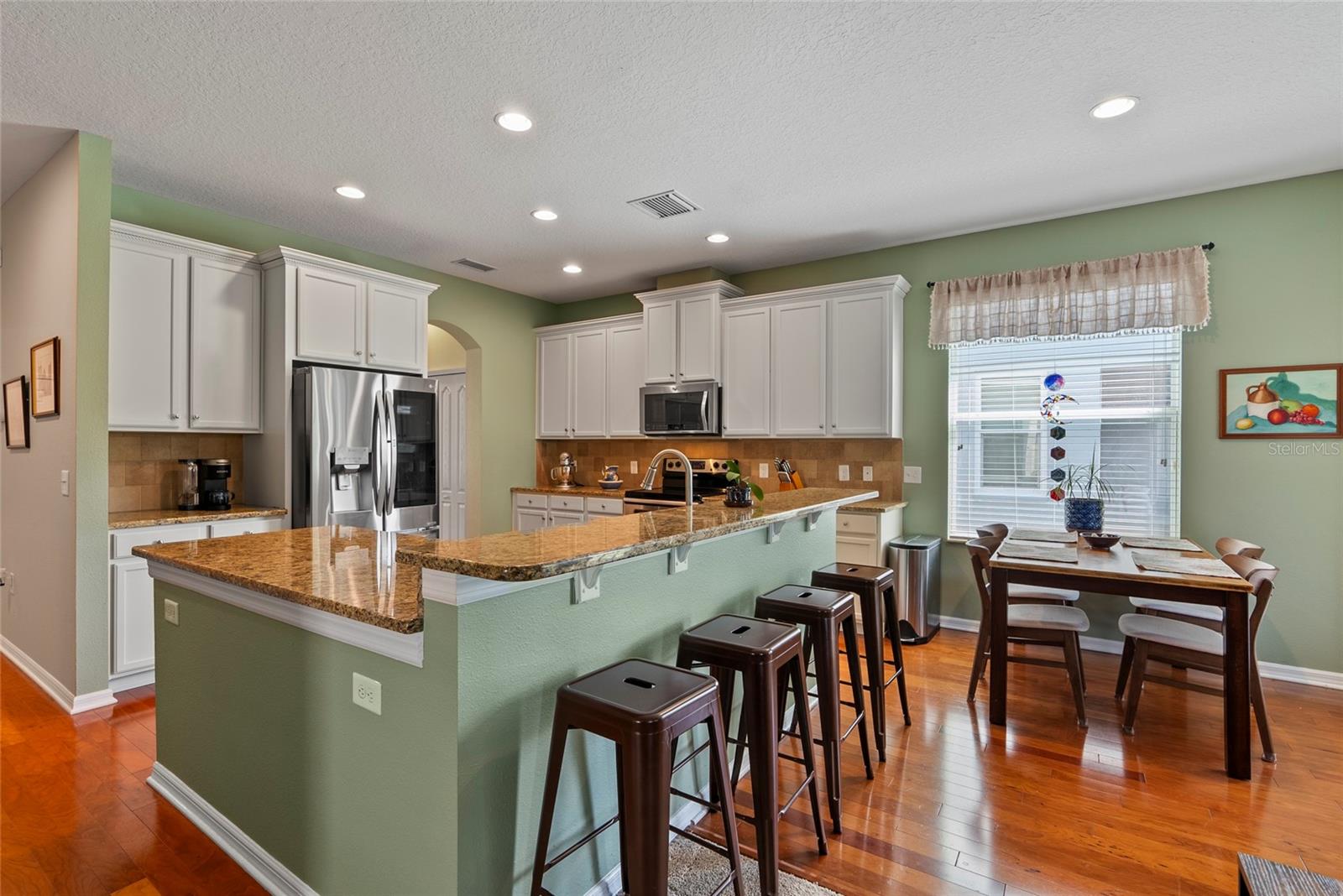 Kitchen with granite countertops and walk-in pantry