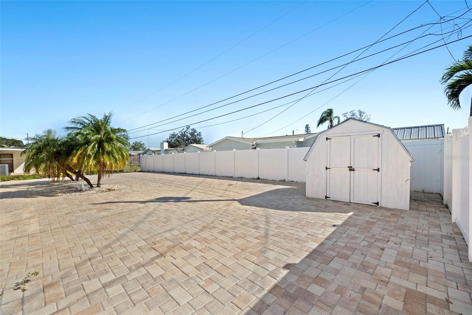 Detached storage shed on cement slab