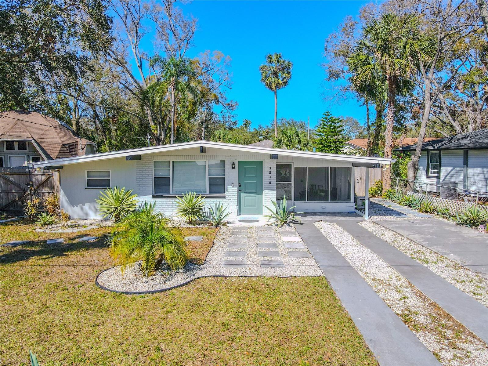 Curb appeal with landscaped yard.