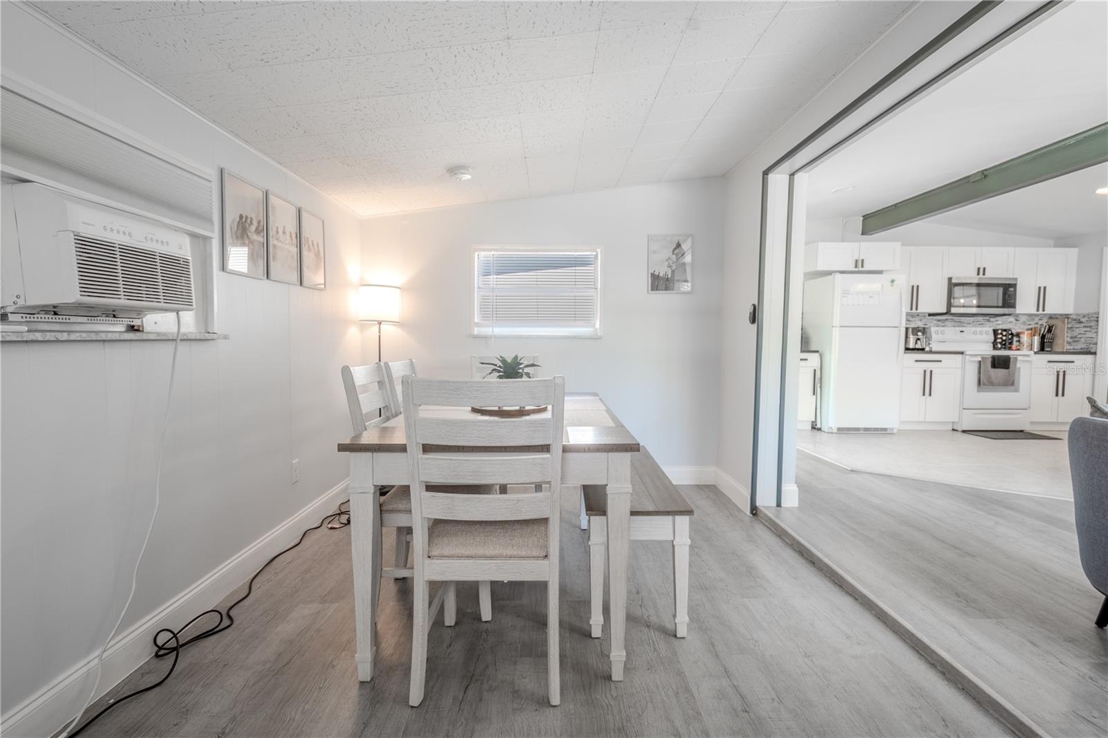 The dining room is open to the living room and kitchen.