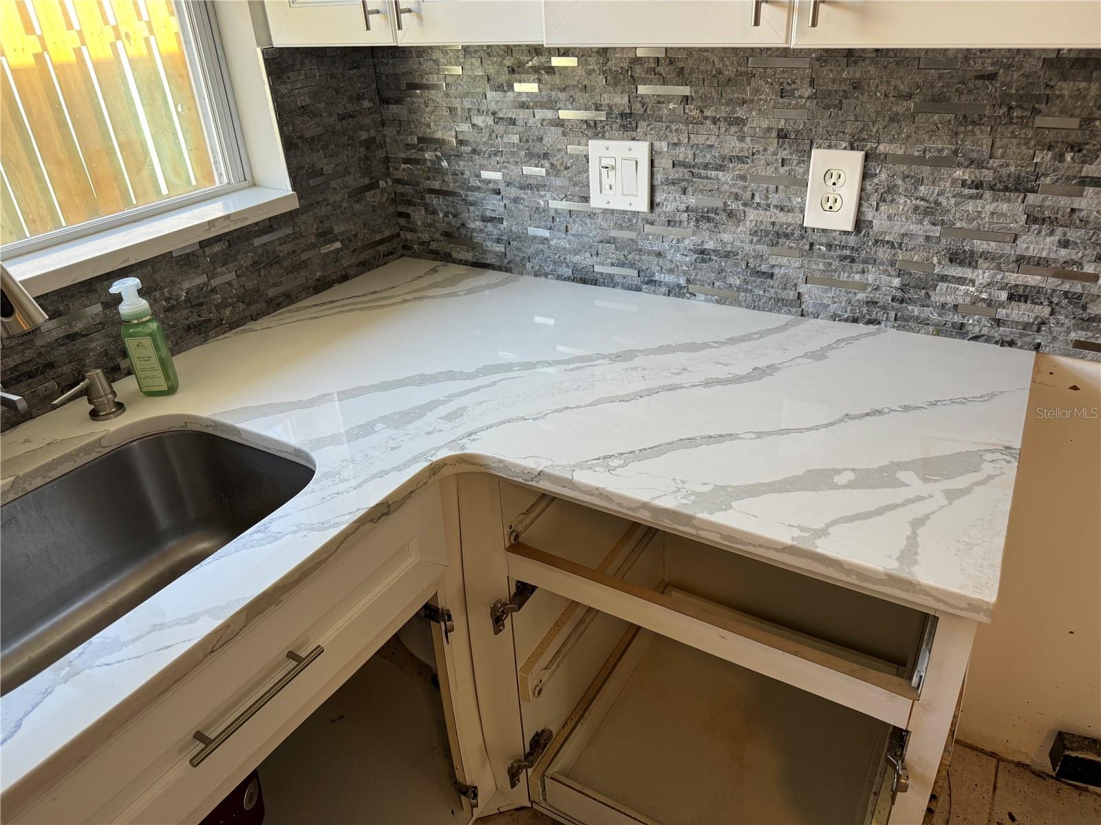 Countertops & Sink were saved and can be reinstalled.