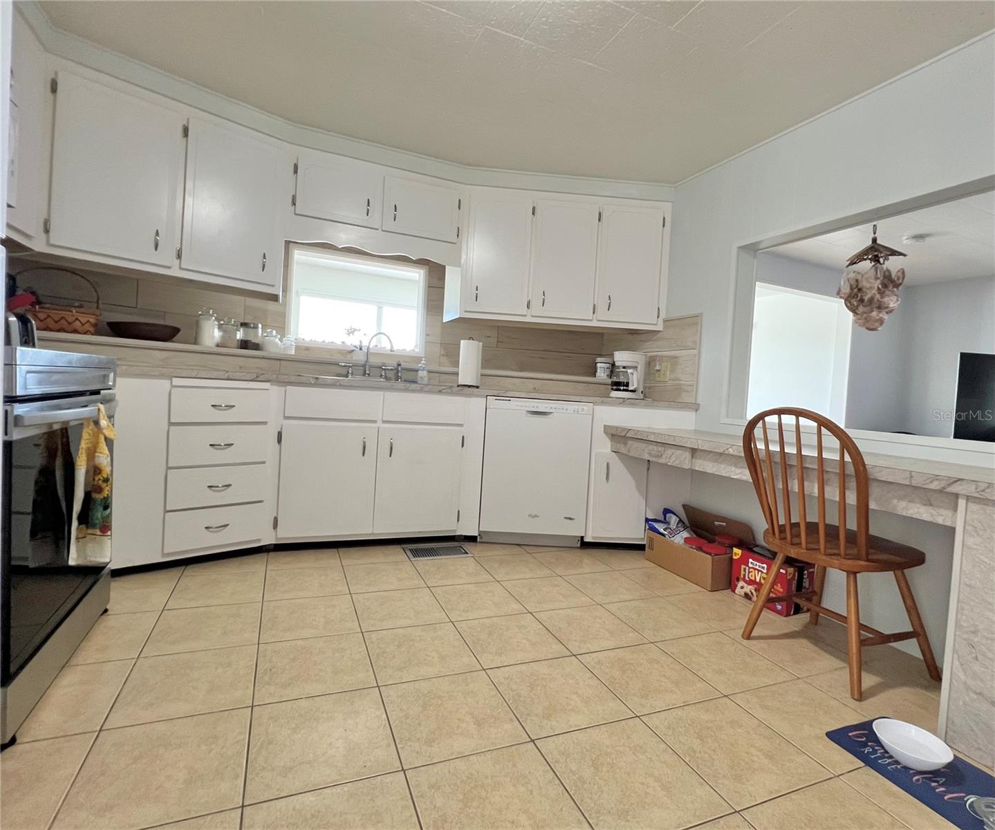 Kitchen with pass through to living room