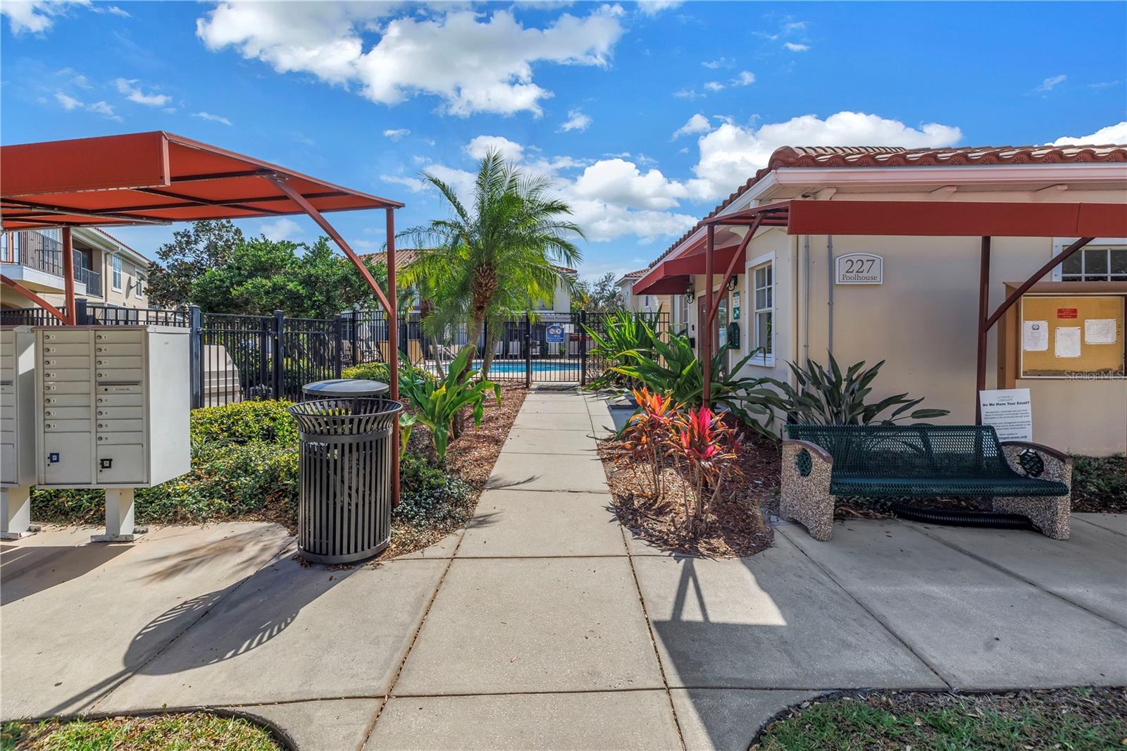 MAILBOX AND ENTRANCE TO COMMUNITY POOL AND POOL HOUSE