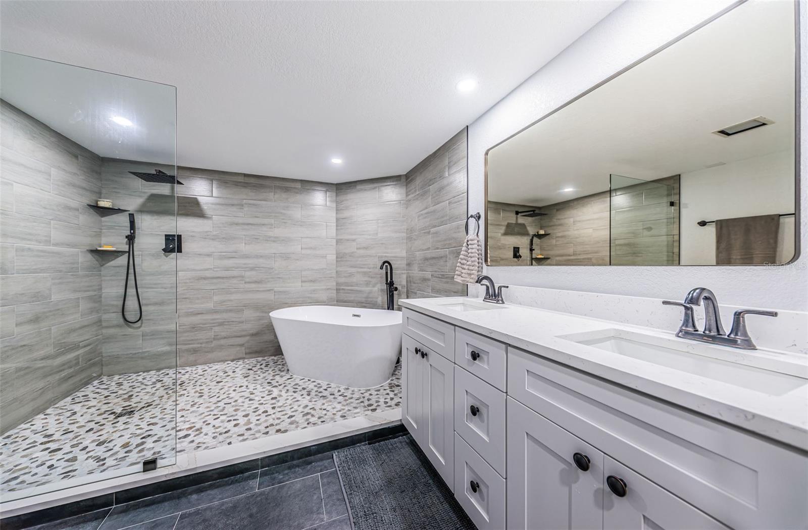 Gorgeous master bathroom - take a look at that shower with soaking tub!