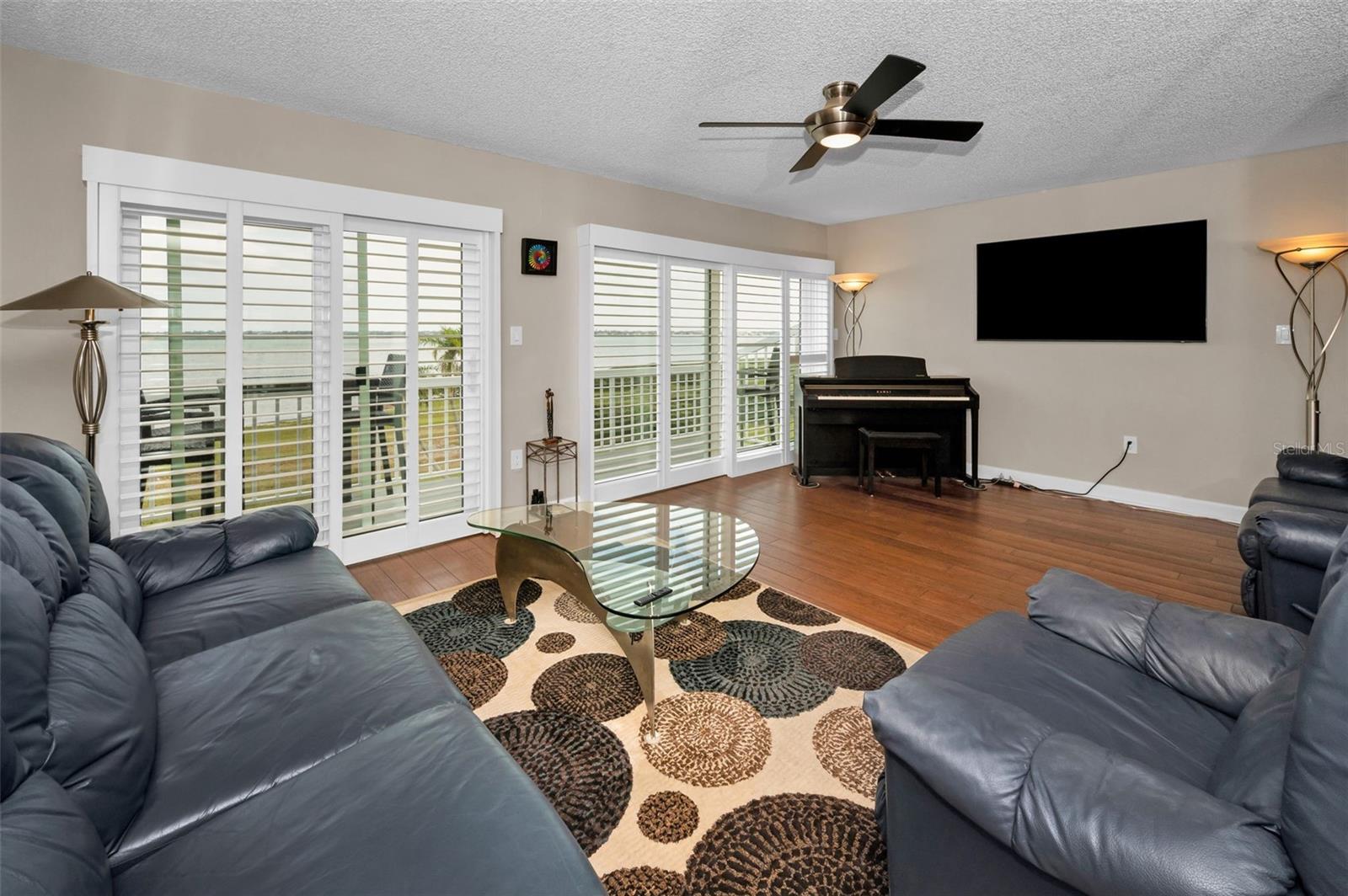 Main level Living Room with Sliding Glass Doors to the Balcony