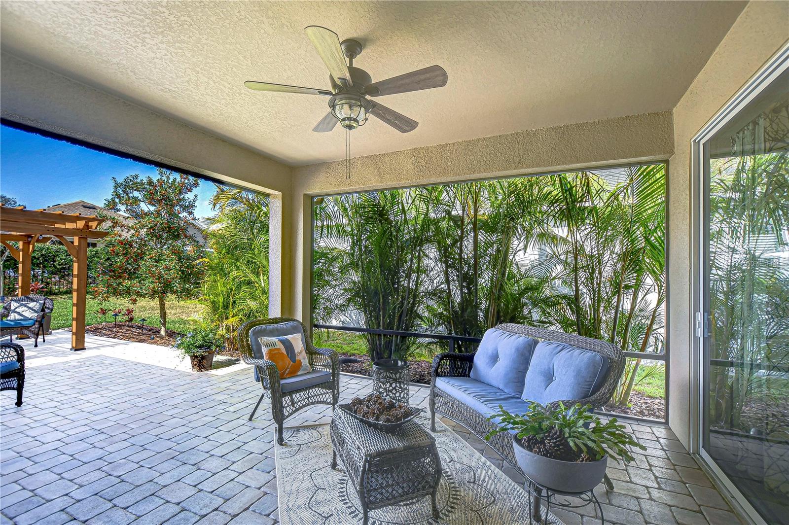 Relax in your private oasis, complete with a screened patio and lush garden views.