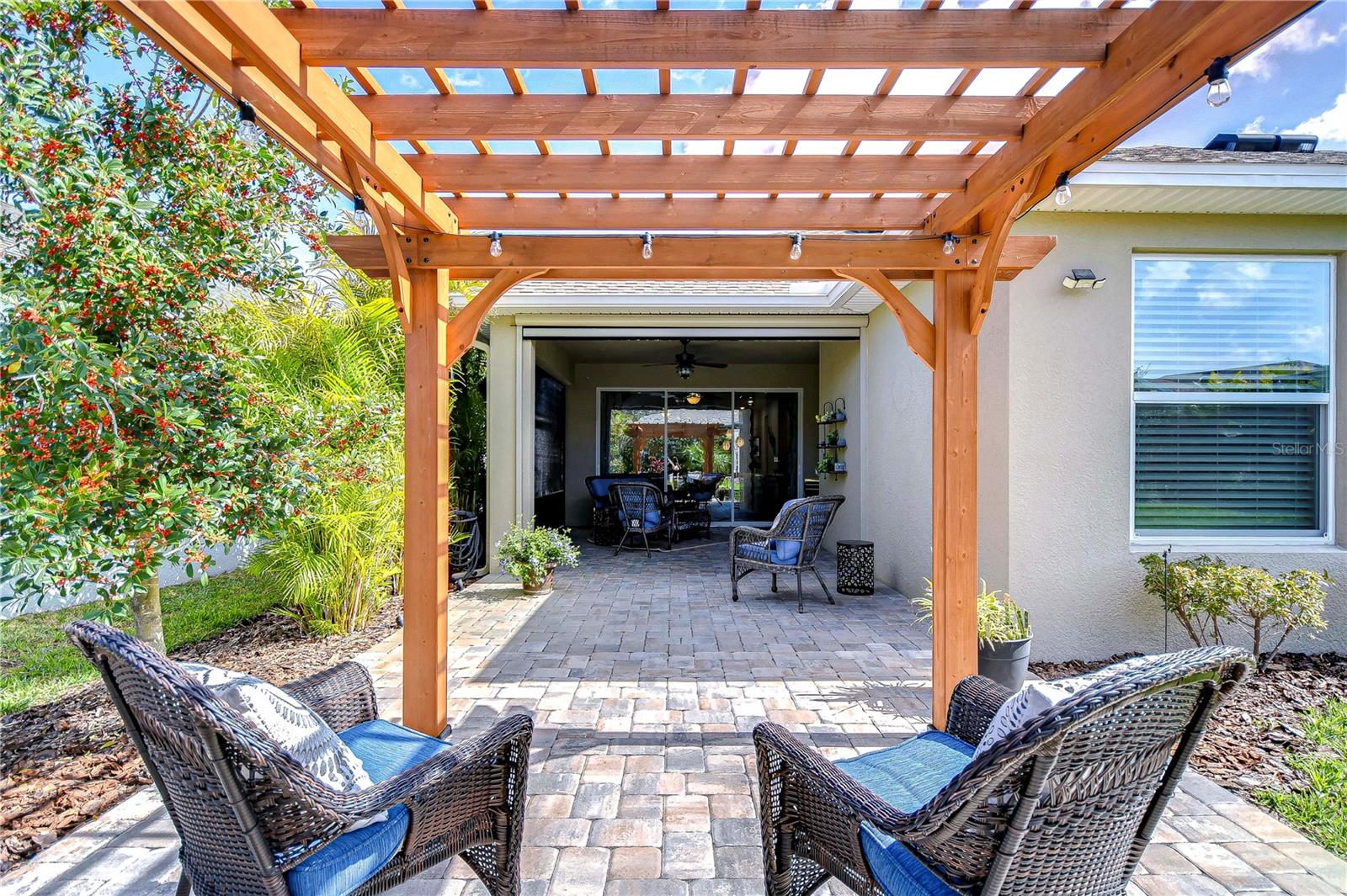 This inviting patio space seamlessly blends comfort and style