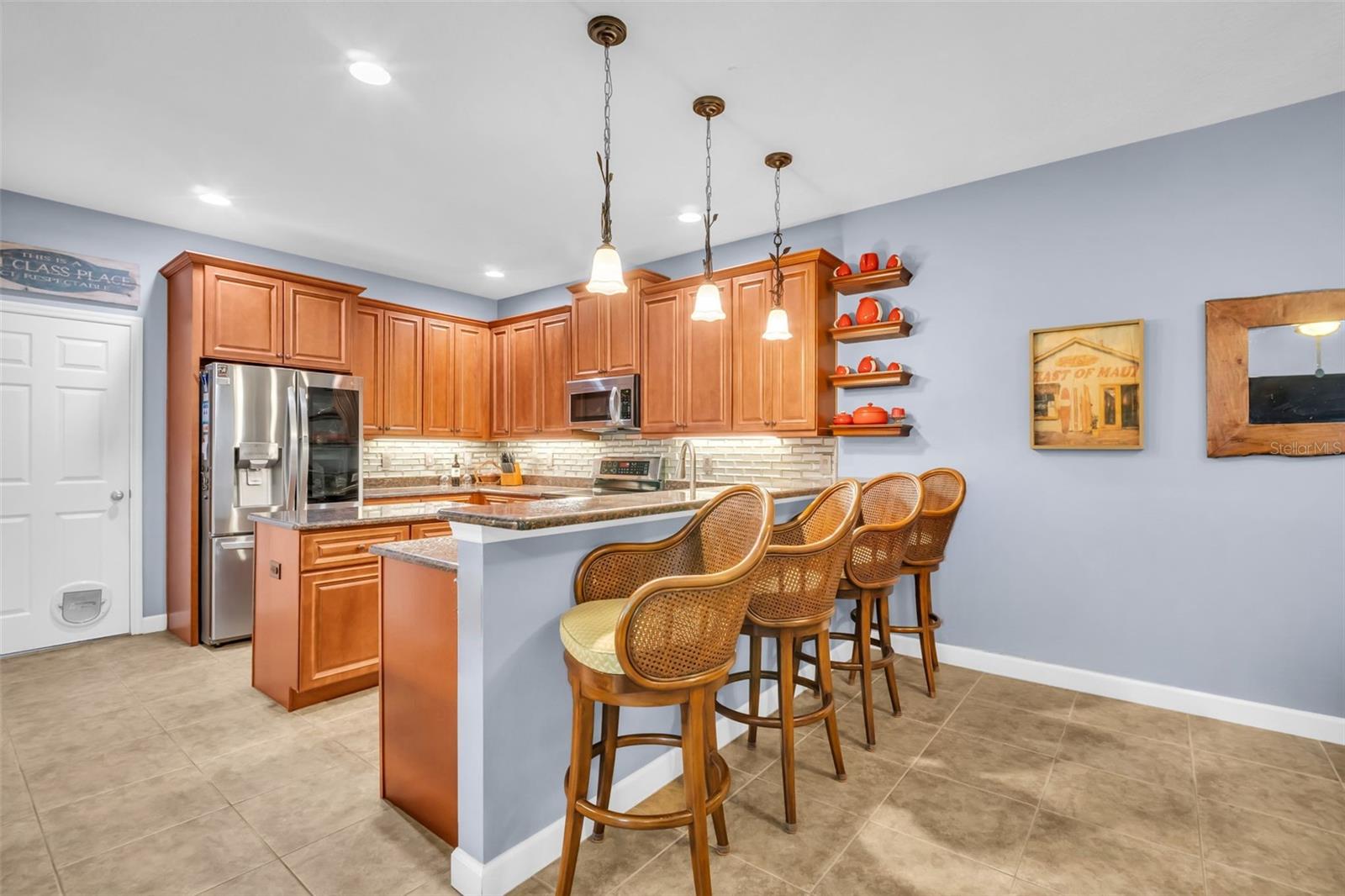 Solid wood cabinets, granite countertops, and newer LG stainless appliances~