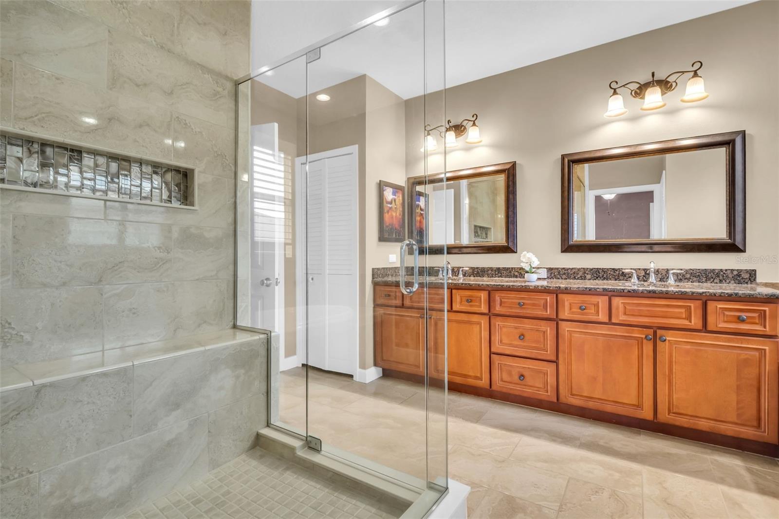 Double vanity, granite countertops, updated lighting, a huge walk-in closet & additional 2 closets for storage~