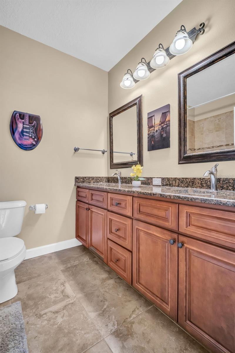 2nd full bath conveniently located between additional bedrooms and family room~