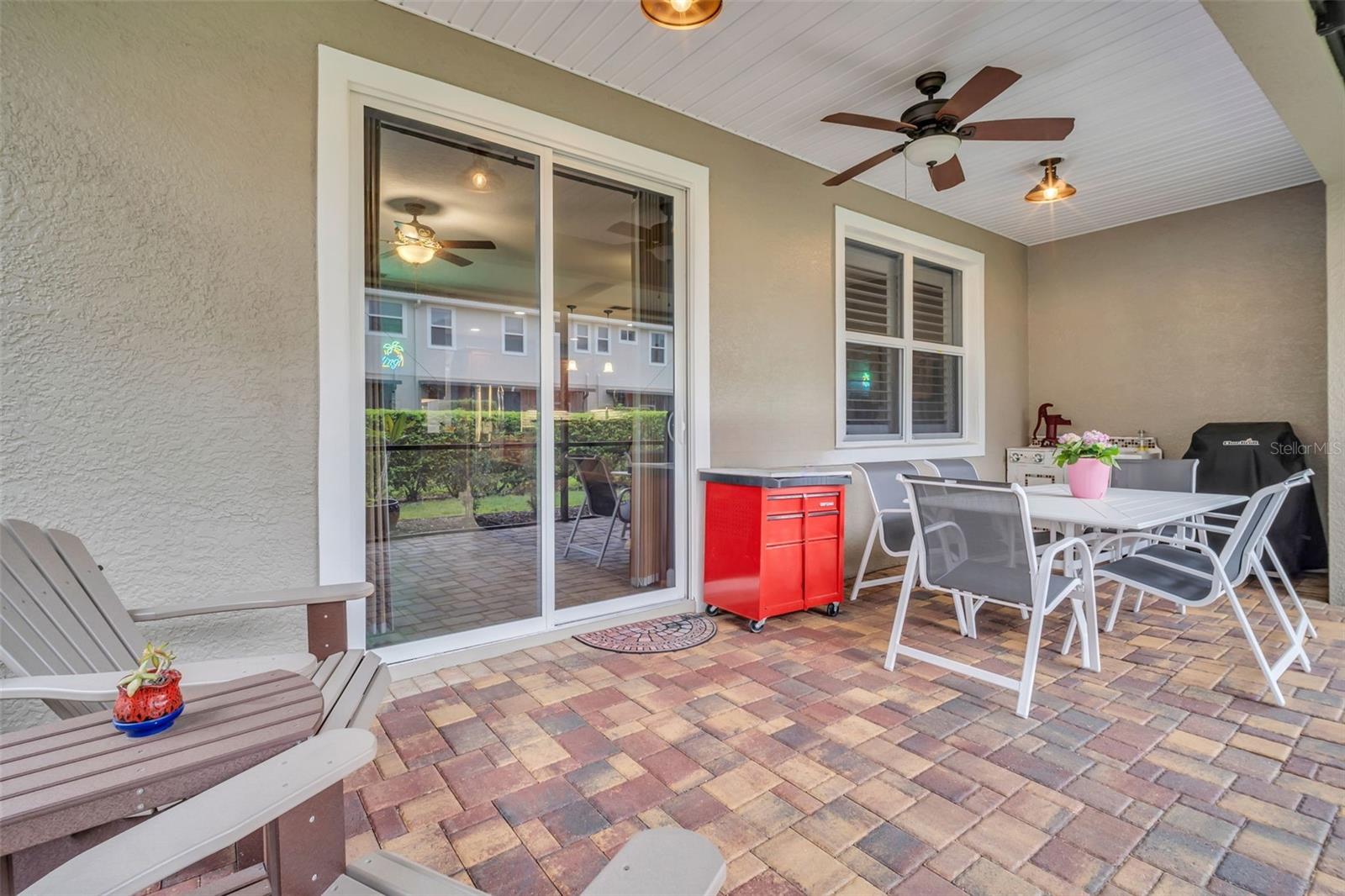 Newer vinyl planking patio ceiling, with updated fan/fixtures~